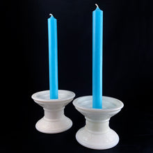Load image into Gallery viewer, This is a really cool pair of vintage milk glass candle holder pedestal with raised swirl detail, circa 1960. What makes them cool and practical is that they accommodate taper candles, 2&quot; votives, 3&quot; pillar and 3.5&quot; pillar candles. Unmarked.  In excellent condition, no chips or cracks.  Measures 4 1/2 x 3 1/4 inches
