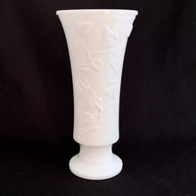 Load image into Gallery viewer, A lovely trumpet shaped footed milk glass vase is embossed with a pattern of intertwining vines.  In excellent condition, no chips or cracks.  Measures 4 1/2 x 9 1/2 inches
