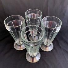 Load image into Gallery viewer, These classic vintage mid-century modern fountainware soda glasses are the real deal, featuring a six panel design, with stippled foot. Crafted by Libbey Glass Canada, circa 1950/60s. Perfect for making tasty floats, milkshakes or sundaes.  In excellent condition, no chips or cracks. Marked &quot;CANADA&quot; on the bottom.  Measures 3 1/4 x 7 inches  Capacity 12 ounces
