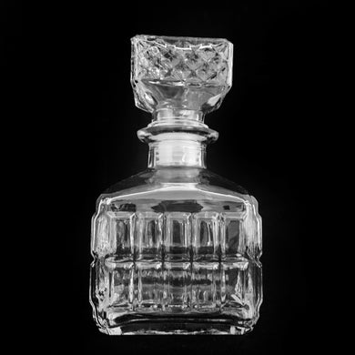 Great vintage liquor decanter pressed with a square pattern with stopper. Circa 1970s. If liquor isn't your thing, fill with your favourite beverage and add a little sparkle to your breakfast/brunch buffet.  In excellent condition, free from chips/cracks.  Measures 3 1/2 x 6 inches