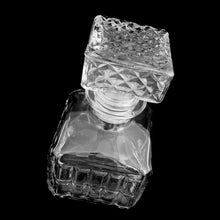 Load image into Gallery viewer, Great vintage liquor decanter pressed with a square pattern with stopper. Circa 1970s. If liquor isn&#39;t your thing, fill with your favourite beverage and add a little sparkle to your breakfast/brunch buffet.  In excellent condition, free from chips/cracks.  Measures 3 1/2 x 6 inches
