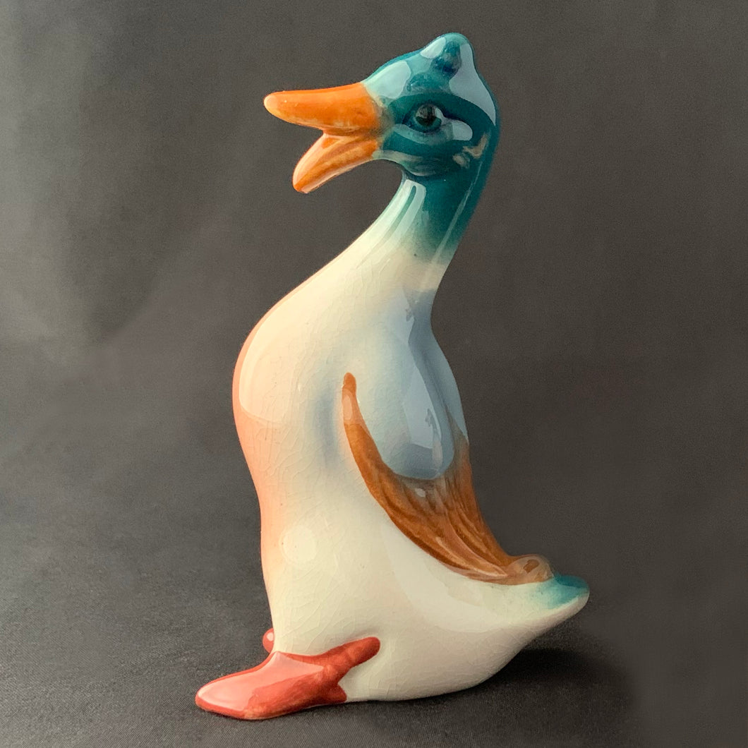 Charming vintage hand painted porcelain miniature standing Mallard duck figurine. Produced by Beswick, England.   In excellent condition, no chips or cracks. Handwritten mark 4L.  Measures approximately 2