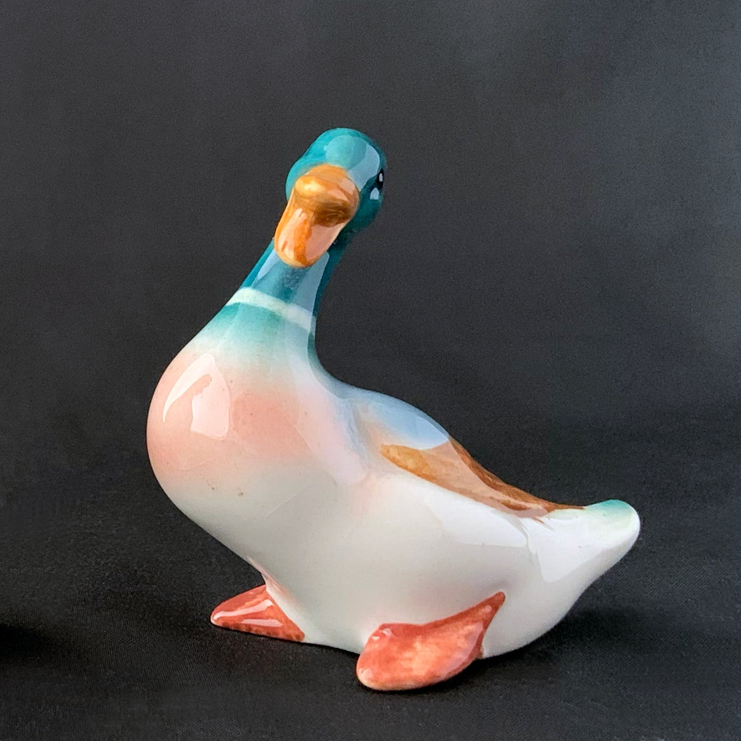 Charming vintage hand painted porcelain miniature seated Mallard duck figurine. Produced by Beswick, England.   In excellent condition, no chips or cracks. Handwritten mark 4L.  Measures approximately 1-1/2