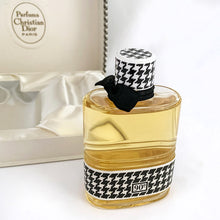 Load image into Gallery viewer, Vintage full 2 ounce bottle of &#39;Miss Dior&#39; eau de toilette in gift box. Created by perfumer François Demachy for Christian Dior, Paris France. As Dior&#39;s debut fragrance, Miss Dior was introduced in 1947 alongside the first Christian Dior collection in Paris at 30 Avenue Montaigne.
