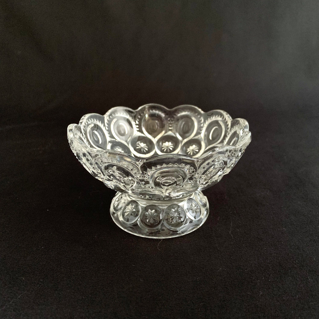 Sweet vintage clear pressed glass footed nappy dish in the 