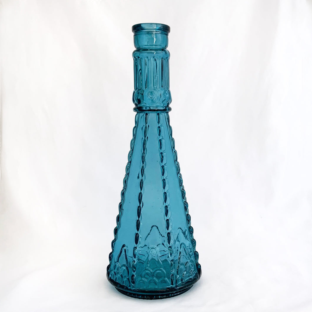 Beautifully detailed, collectible boho style teal glass bottle or decanter. Produced by Morey Mallorca Destilerias in Spain. Circa 1970.  In excellent condition.  Measures 4 1/4 x 11 1/2 inches