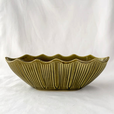Vintage moss green oval shaped ceramic pottery planter with vertical rib pattern and scalloped edge, shape 628. Produced by Mount Clemens Pottery, USA, circa 1960s. In 1967, MCP purchased McCoy Pottery. A lovely planter for succulent garden or small houseplants. Could be used as a catchall or decor piece.  In excellent condition, free from chips/cracks/repairs.  Measures 11 x 3 3/4 x 3 3/8 inches