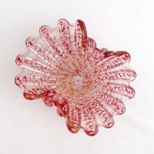 Load image into Gallery viewer, A stunning vintage pink and clear art glass shell shaped ashtray. This mid century piece has thick, ribbed glass in the style of a sea shell with controlled bubbles or bullicante and liberally infused with gold aventurine flecks. The wide scalloped edges are hand tooled. Attributed to Barovier and Toso, Murano, Italy, circa 1960. In good vintage condition. Polished bottom with minor bites which do not detract from the beauty of this piece.  Size: 8-1/4 x 6-1/4 x 2-3/4
