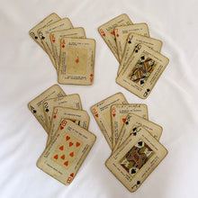 Load image into Gallery viewer, This rare deck of The Nile Fortune Telling Cards is fascinating. The backs are beautifully illustrated with an Egyptian sphynx and pyramids in reflection surrounded by florals. Each face card aside from the suit and number has four prophecies or sayings, somewhat similar to fortune cookie fortunes. The black case has a metal clip to hold the deck in place along with a snap button closure. Produced by the U.S. Playing Card Co. Cincinnati Ohio copyright 1897-1904. 
