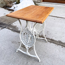 Load image into Gallery viewer, Upcycled vintage cast iron Singer sewing treadle table, painted creamy white with pine wood top. Perfect as an hall/end table, microwave or plant stand!
