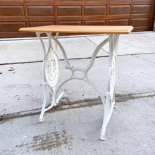 Load image into Gallery viewer, Upcycled vintage cast iron Singer sewing treadle table, painted creamy white with pine wood top. Perfect as an hall/end table, microwave or plant stand!
