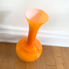 Load image into Gallery viewer, This vintage mid-century Empoli art glass vase features a captivating white interior encased in an orange exterior complete with a clear pedestal - an ideal accent piece for adding vibrancy to your home décor.  In excellent condition, free from chips/cracks.  Measures 7 1/2 x 16 inches
