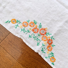 Load image into Gallery viewer, A sweet white linen tablecloth hand embroidered with orange and yellow flowers with green leaves.  In excellent condition free from stains/tears.  Measures approximately 42-1/2&quot; x 39-1/2&quot;
