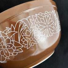 Load image into Gallery viewer, Vintage set of three Pyrex milk glass mixing bowls in the Woodland pattern. Bowl sizes are 401 750ml; 5 1/2&quot;, 402 1.5 litres; 7&quot;, 403 2.5 litres; 8 1/2&quot;. Number 403 and 401 are brown with white flowers and 402 has a tan background with white flowers. Oven and microwave safe; great for serving and food storage. Produced by Corning, NY, USA between 1978 - 1985. All pieces are in excellent condition, free from chips, cracks, stains, wear. These have not seen a dishwasher and look practically brand new! 

