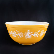 Load image into Gallery viewer, Classic vintage PYREX &quot;Butterfly Gold&quot; milk glass mixing bowl. This is the 403 which holds 2-1/2 quarts. This sweet pattern of flowers and butterflies was designed by Gregory Mirow and produced by Corning USA between 1972 - 1979. Great for mixing, food storage and are oven and microwave safe....all from this timeless classic! Very good vintage condition, free from chips/cracks. MInor wear and some scratches to the gold which is still shiny and vibrant. Dimensions: 8-3/4&quot; x 4-1/8&quot;
