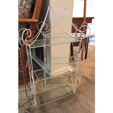 Fantastic vintage Hollywood Regency pagoda shaped wire shelf painted white with three glass shelves. Perfect for displaying collectibles, bath products.  In good vintage condition.  Measures approximately 14 x 4 x 20 inches Jacks Daughter of All Trades Vintage Antique Retro Mid-Century Modern Kitsch Store Shop Reseller Etsy Shopify Toronto Canada Free Porch Pick Up Local Delivery Worldwide Shipping Judy Weinberg Unique Housewarming Hostess Sustainable Gift