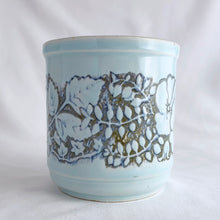 Load image into Gallery viewer, Lovely vintage stoneware mug beautifully embossed with flowers over a pale blue glaze. Produced by WP, England, circa 1970s.  In excellent condition, free from chips/cracks.  Measures 3 1/4 x 3 3/8 inches
