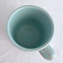 Load image into Gallery viewer, Lovely vintage stoneware mug beautifully embossed with flowers over a pale blue glaze. Produced by WP, England, circa 1970s.  In excellent condition, free from chips/cracks.  Measures 3 1/4 x 3 3/8 inches
