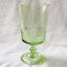 Load image into Gallery viewer, Stunning apple green vintage style footed water goblet. The glass has a starburst foot and the lower half of each glass has a ribbed detail. A beautiful addition to any tablescape!  In excellent condition, free from chips or cracks. Made by Martha Stewart in the USA.  Measures 3 1/2 x 6 1/2 inches  Capacity 15 fluid oz
