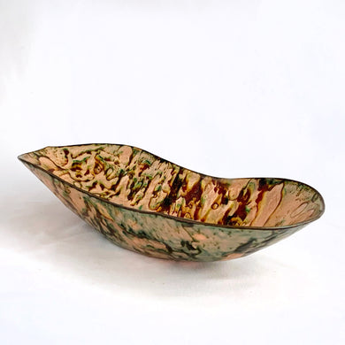 Vintage artisan made copper enamel oblong shaped bowl in shades of peach, green and toffee. Signed by the artist, Ken Slate '89.  In excellent condition.  Measures 9-1/4