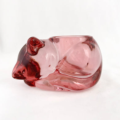 Adorable cranberry pink candle holder of a curled up sleeping kitty cat. Produced by Indiana Glass Company in the USA. Add ambience to your home decor! Jacks Daughter of All Trades Vintage Antique Retro Mid-Century Modern Kitsch Store Shop Reseller Etsy Shopify Toronto Canada Free Porch Pick Up Local Delivery Worldwide Shipping Judy Weinberg Unique Housewarming Hostess Sustainable Gift Home Decor Collectible Collector Mothers Day Farmhouse Cottage Core Shabby Chic