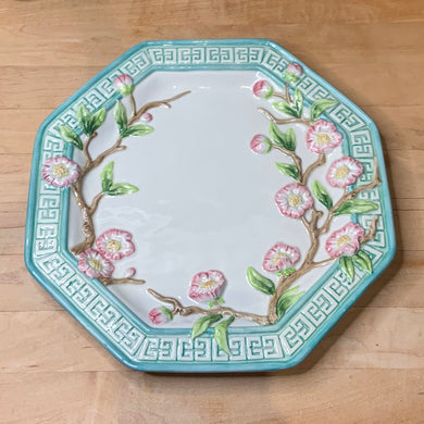 Beautiful vintage decorative plate in an octagon shape decorated pretty pink cherry blossom branches in relief, surrounded by an aqua coloured border with greek key design. Produced by Fitz & Floyd Essentials, circa 1990s. This piece has two holes on the back for ease of hanging. What a great piece of wall decor! In excellent condition, free from chips/cracks/repairs.  Measures approximately 11 inches in diameter.
