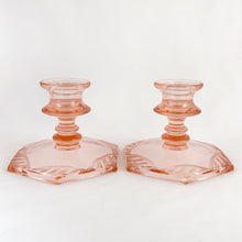 Load image into Gallery viewer, Pair of lovely vintage etched hexagonal shaped pink Depression Glass single lite taper candle holders or candlesticks. The etched glass ribbon pattern repeats around the base making them quintessentially art deco in style. Perfect for everyday use, special occasions/events and also nicely suited to cottage chic decor.  In excellent condition, no chips or cracks.  Measures 4 1/2 x 3 3/4 inches

