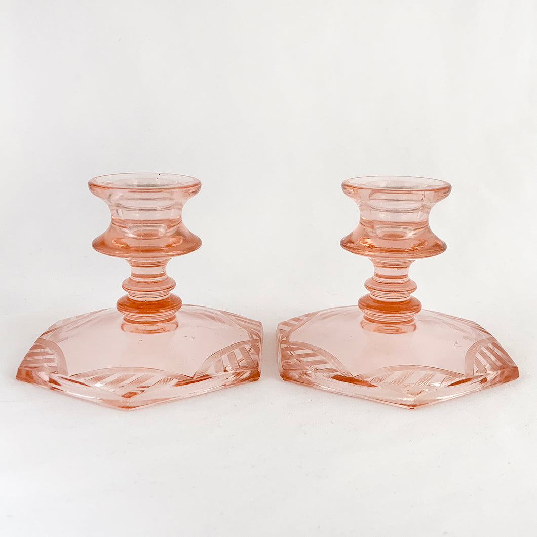 Pair of lovely vintage etched hexagonal shaped pink Depression Glass single lite taper candle holders or candlesticks. The etched glass ribbon pattern repeats around the base making them quintessentially art deco in style. Perfect for everyday use, special occasions/events and also nicely suited to cottage chic decor.  In excellent condition, no chips or cracks.  Measures 4 1/2 x 3 3/4 inches