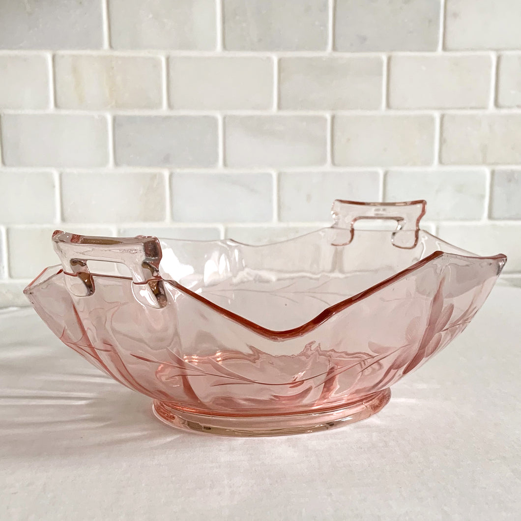 This bowl is the prettiest piece of pink depression glass, etched with flowers and leaves on three (3) satin (frosted) feet. It's screams elegance! Originally produced as a candy bowl, it could easily be repurposed as a vessel for just about anything. It's such a beauty, simply admire it as a stunning decor piece.  In excellent vintage condition, no chips or cracks. Made by Lancaster Glass Company, circa 1930.  Measures 6-1/4