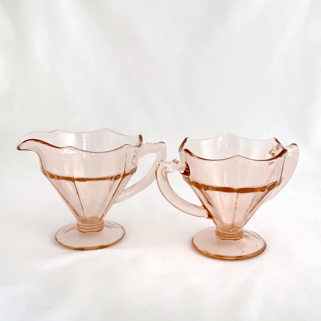 Stunning pink depression glass creamer and sugar in the 