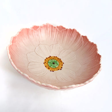A lovely vintage pink serving bowl embossed with a lotus flower design. It's pretty pink interior is punctuated with a yellow and green centre. Crafted by Royal Winton Grimwades, England, circa 1930. A beautiful serving bowl or decor piece.

In excellent condition, no chips or cracks. Crazing present.

Measures 9 1/4 x 3 inches