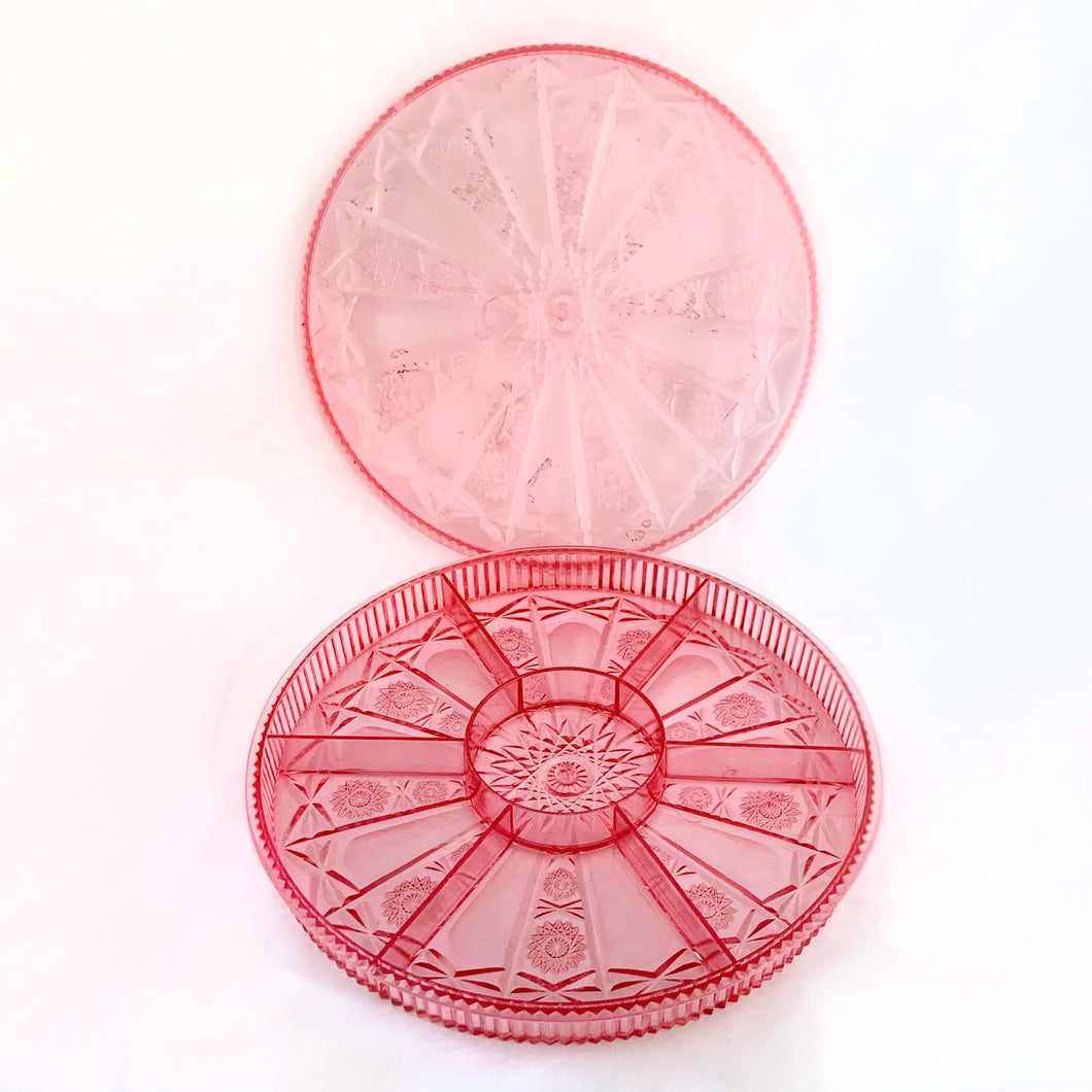 Vintage plastic divided storage tray with lid in a pinwheel pattern. Use to store candies and/or nuts, veggies and dip, or repurpose to store craft supplies.

In good vintage condition with some wear.

10 3/4 x 1 1/4 inches