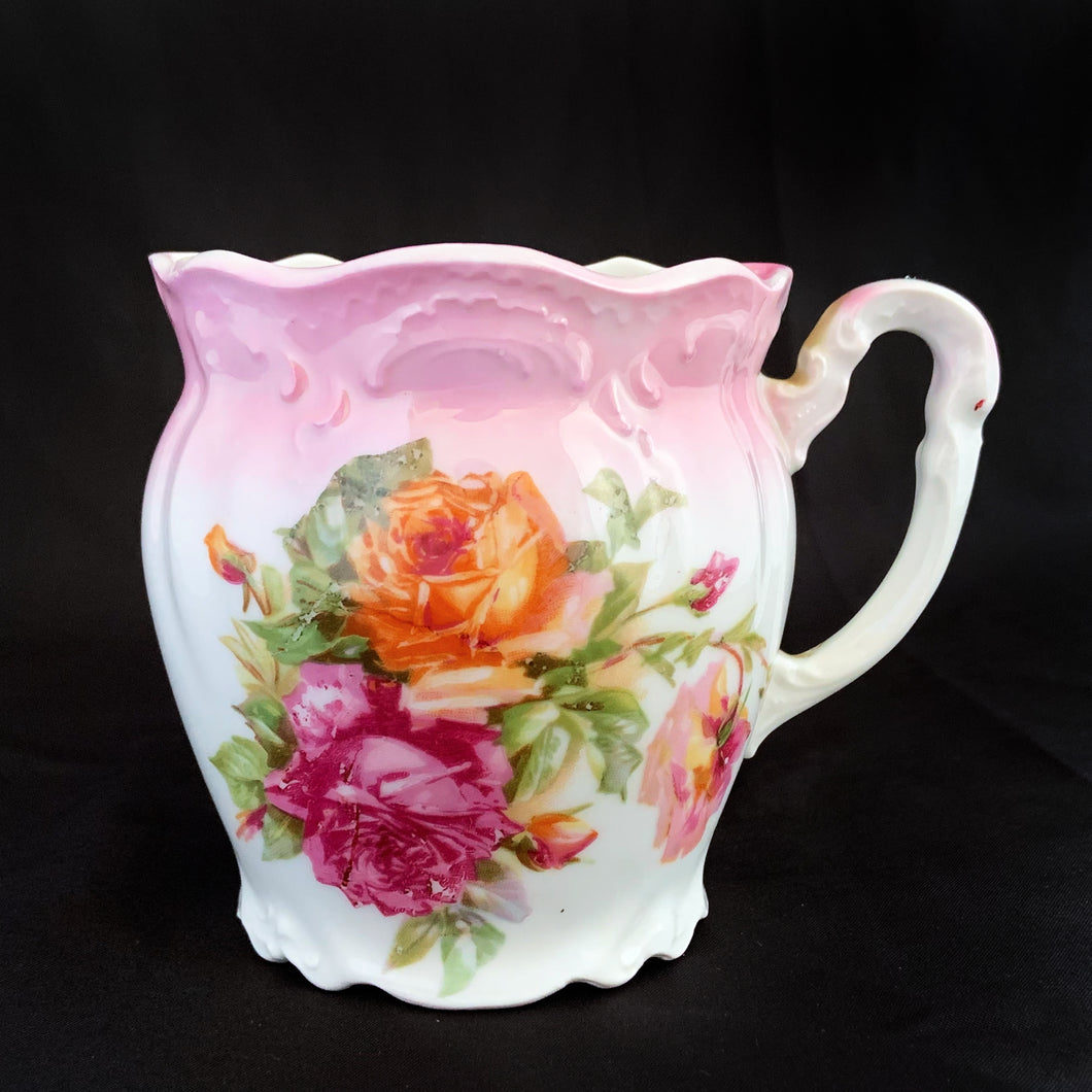 This vintage white porcelain shaving mug has with lovely pink and yellow roses with gold rim. Use as intended or repurpose as a toothbrush or make-up brush holder.  Stamped 