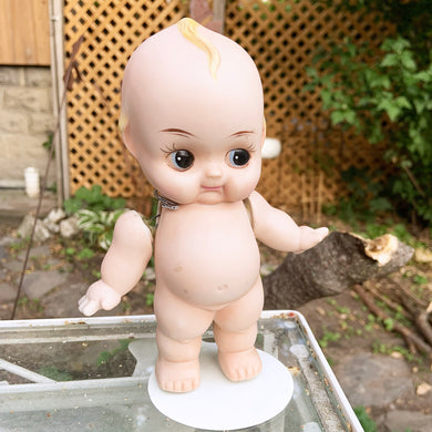 Rare porcelain bisque Kewpie Doll figurine with moveable string jointed arms. It's difficult to find this specific one standing with its legs apart which is what makes this one rare.  Excellent vintage condition, free from chips or cracks. String could be tightened.  This delightful little cutie stands at approximately 7