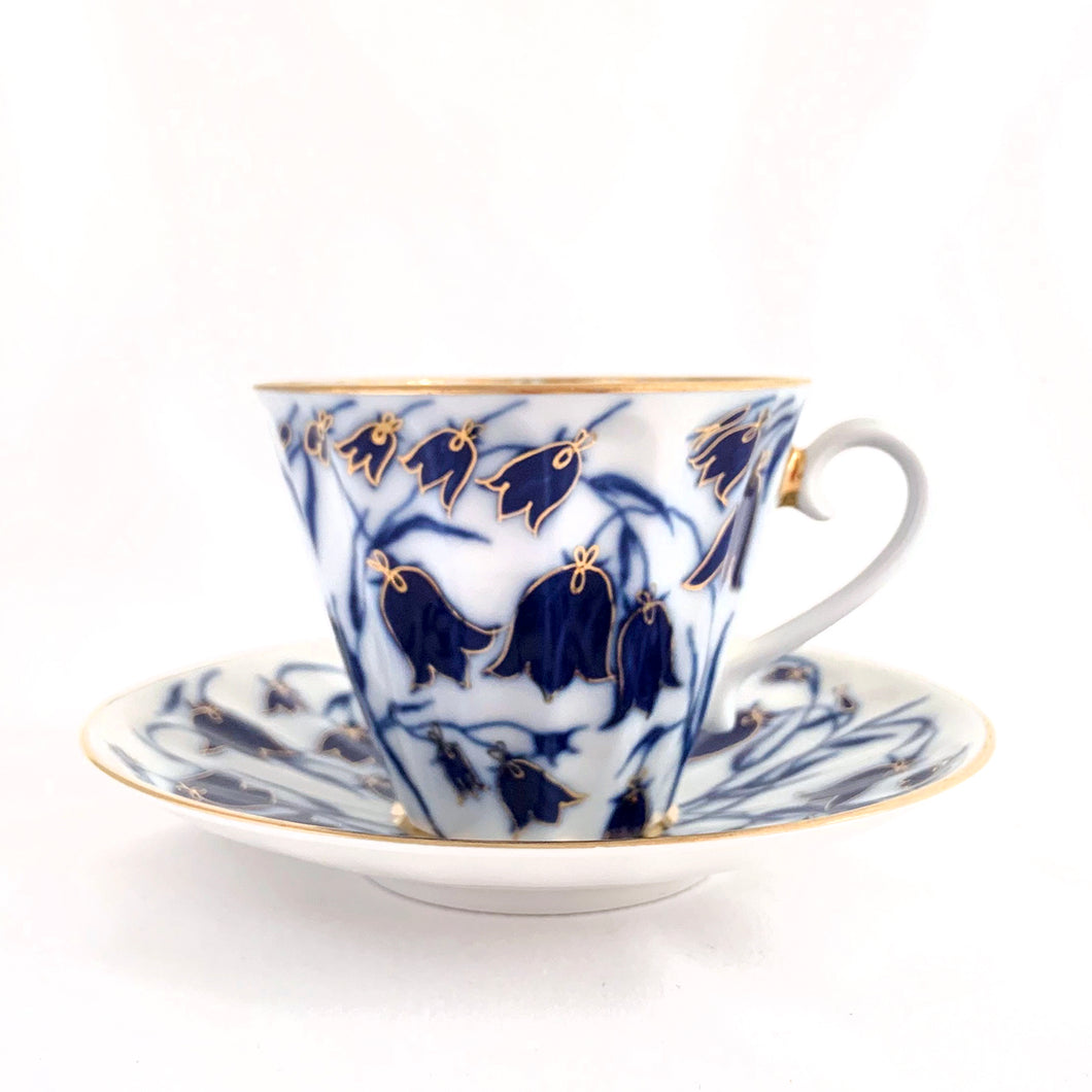 Elegant porcelain tea cup and saucer, hand painted with blue bell flowers with gold details (design 1744). Produced by Russian Imperial Lomonosov in St. Petersbourg, Russia.  In excellent condition, free from chips/cracks/wear. Makers marks on the bottom of each piece.  Tea cup measures 3-1/2