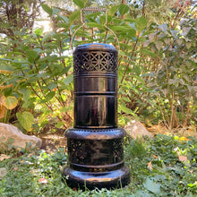 Load image into Gallery viewer, This piece brings a meaning to circular economy and repurposing vintage and antique goods. Produced by Valor in the UK, this vintage kerosene heater can easily be refurbished, or it could be upcycled as a decor piece for a night light or plant stand. It&#39;ll make a great conversation piece either whatever it&#39;s use!  In good vintage condition, some minor rust present. Brass kerosene bottle included. Measures approximately 24 inches tall.  Please note: we do not warranty use as a kerosene heater.
