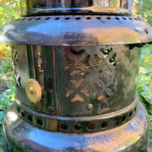 Load image into Gallery viewer, This piece brings a meaning to circular economy and repurposing vintage and antique goods. Produced by Valor in the UK, this vintage kerosene heater can easily be refurbished, or it could be upcycled as a decor piece for a night light or plant stand. It&#39;ll make a great conversation piece either whatever it&#39;s use!  In good vintage condition, some minor rust present. Brass kerosene bottle included. Measures approximately 24 inches tall.  Please note: we do not warranty use as a kerosene heater.
