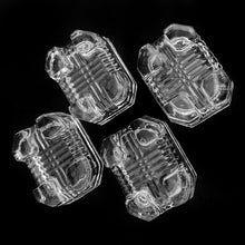 Load image into Gallery viewer, Set of four vintage art deco style clear pressed glass rectangular footed salt cellars.  Each measures 1-7/8 x 1-1/2 x 3/4 inches  In good vintage condition.
