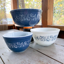 Load image into Gallery viewer, Vintage set of three (3) Pyrex milk glass mixing bowls in the &quot;Colonial Mist&quot; pattern. Bowl sizes are 401, 402 and 403. Number 403 and 401 have a blue background with white daisies and 402 has a white background with blue daisies. Produced by  Corning, NY, USA. Oven and microwave safe; ovenware and serveware.  In excellent condition, free from chips, cracks, stains, wear. These have not seen a dishwasher and look practically brand new!
