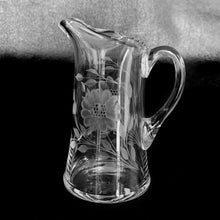 Load image into Gallery viewer, This classically shaped vintage pitcher, cut by WJ Hughes with two 12-petal &quot;Corn Flowers&quot; and leaf sprays, beaded edge with hand blown applied glass handle. Unidentified glass blank. Circa 1940s. An elegant addition to your tablescape. Would make a beautiful gift!  In excellent condition, free from chips or cracks.  Measures 6&quot; tall
