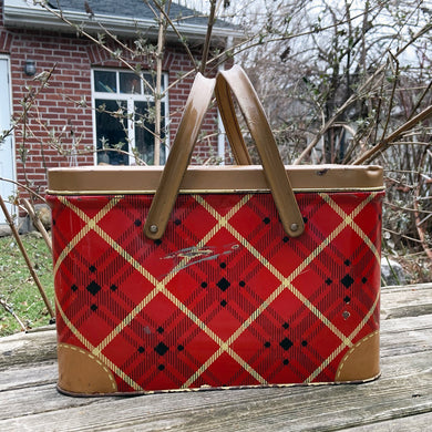 mid-century vintage red, black and yellow plaid metal picnic basket. Perfect for storing crafts, use as a display piece or as intended and enjoy a lovey picnic. GSW is punched into the sidewall of the basket. Produced by General Steel Wares, circa 1950. GSW is a Canadian company founded in the mid 1800s still in operation today. In fair vintage condition with wear and rust spots, handles are solid, a small hole in the bottom. This basket measures 13