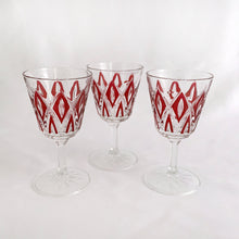Load image into Gallery viewer, These unique mid-century Reims &quot;Harlequin&quot; crystal wine glasses will be a stunning addition to any bar display or table! The colors is a vibrant red. Durable, resistant, and classic, the crystal is cut so that the glass makes a diamond design. These are hard to come by!  In excellent, no chips or cracks. Marked on the bottom &quot;FRANCE&quot;.  Measures 2-1/2&quot; x 4-1/2&quot;  Capacity 4 ounces
