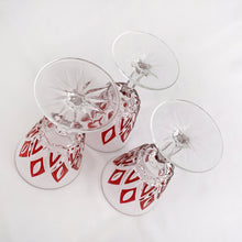 Load image into Gallery viewer, These unique mid-century Reims &quot;Harlequin&quot; crystal wine glasses will be a stunning addition to any bar display or table! The colors is a vibrant red. Durable, resistant, and classic, the crystal is cut so that the glass makes a diamond design. These are hard to come by!  In excellent, no chips or cracks. Marked on the bottom &quot;FRANCE&quot;.  Measures 2-1/2&quot; x 4-1/2&quot;  Capacity 4 ounces
