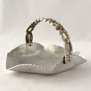 This sweet vintage mid-century hammered aluminum basket is embossed in the 