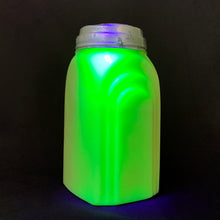 Load image into Gallery viewer, Vintage &quot;Roman Arch&quot; custard uranium glass shaker. Produced by McKee Glass, circa 1950. This beautiful art deco style piece glows bright green under black light. The printing has come off over time.  In good vintage condition, free from chips/cracks. Metal lid is worn.  2&quot; x 2-3/8&quot; x 4-1/8&quot;

