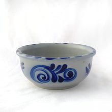 Load image into Gallery viewer, Beautiful salt glazed pottery has such a magical quality with its simple, yet decorative shapes, typically cream coloured stoneware pottery with cobalt blue designs. As a functional piece, it lends itself to many decor styles. This one would make a charming catchall or decor piece.  In excellent condition, no chips or cracks. Unmarked.  Measures 6 7/8 x 2 7/8 inches
