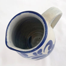 Load image into Gallery viewer, Pretty and practical limited edition salt-glazed pottery creamer or milk pitcher with a floral design in cobalt blue. Marked 73/92 on the bottom.  In excellent condition, no chips or cracks.  Measures 4&quot; x 4-3/4&quot;
