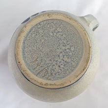 Load image into Gallery viewer, Pretty and practical limited edition salt-glazed pottery creamer or milk pitcher with a floral design in cobalt blue. Marked 73/92 on the bottom.  In excellent condition, no chips or cracks.  Measures 4&quot; x 4-3/4&quot;
