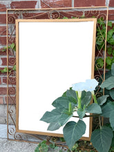Load image into Gallery viewer, A vintage mirror featuring a fabulous wrought iron scroll design, painted gold and backed in wood. All ready to hang!  In great vintage condition
