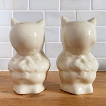 Load image into Gallery viewer, Adorable set of mid-century anthropomorphic Porky Pig ceramic salt and pepper shakers. Produced by Shawnee Pottery, USA, circa 1940.  In excellent condition, free from chips/cracks.  Measures 2-5/8&quot; x 3&quot; x 4-7/8&quot;
